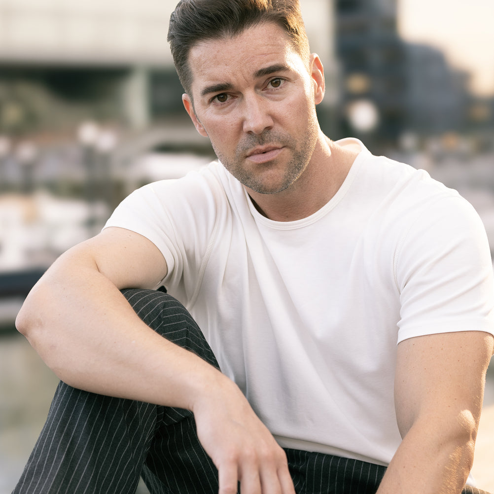 Man in a white crew neck T-shirt