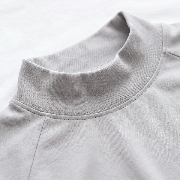 Close-up of Pima cotton interlock knit, ribbed high neck