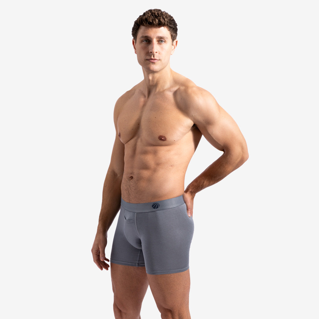 Man wearing gray boxer briefs on a white background