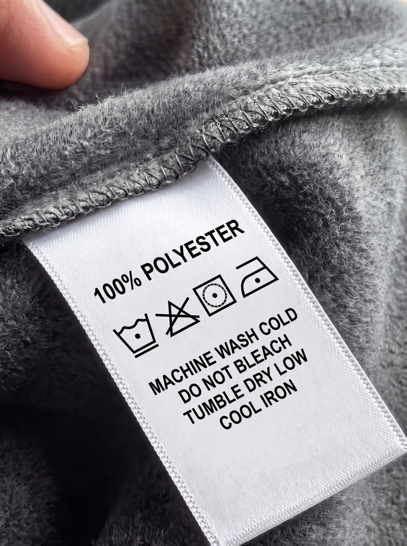 A typical clothing care tag reading 100% polyester