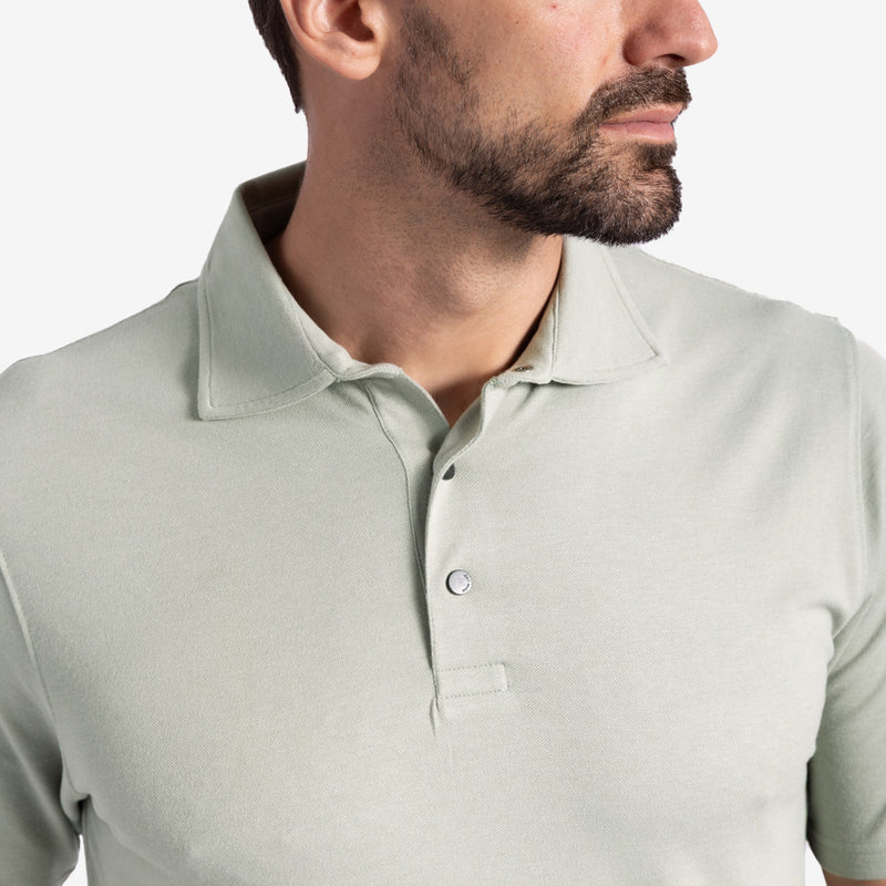 Light green polo shirt worn by a person.