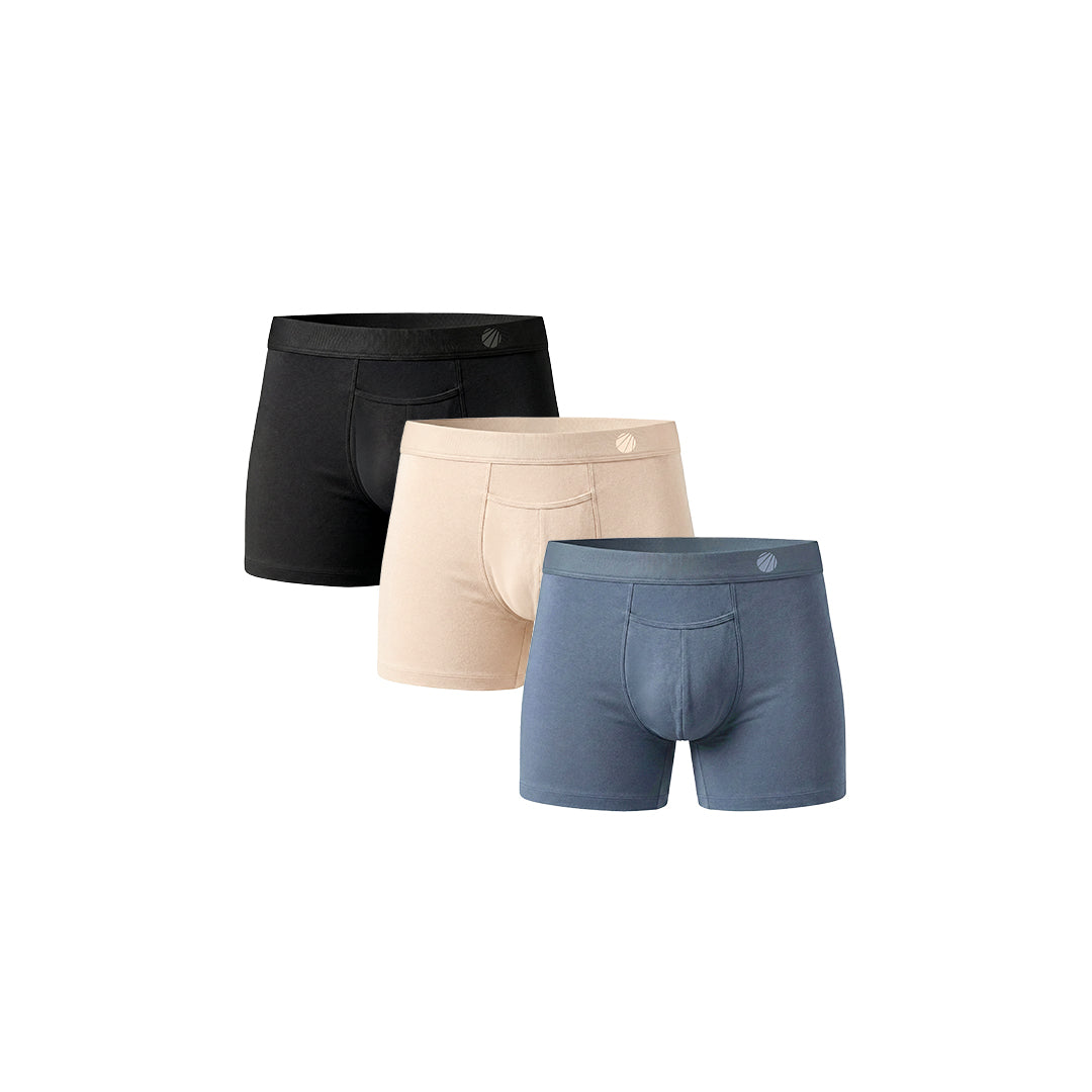 Three pairs of men's boxer briefs in black, beige, and blue on a white background.